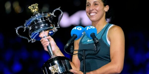 Madison Keys lifts her 2025 Australian Open trophy after winning her first Grand Slam title